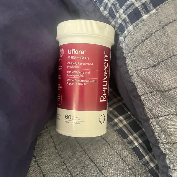 A bottle of Proviva probiotics on a plaid fabric background.